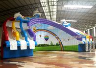3 लेन 30mL पीवीसी के साथ रंगीन इंद्रधनुष आर्क आकार Inflatable पानी स्लाइड